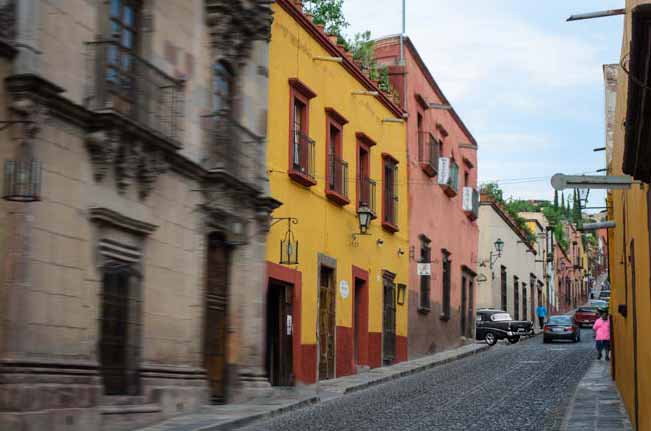 Luxury condos and traffic-filled narrow, cobblestone streets